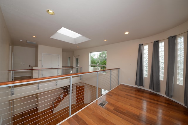 315 11th St SW, Albuquerque, NM 87102 - hall with wood-type flooring, a skylight, and recessed lighting