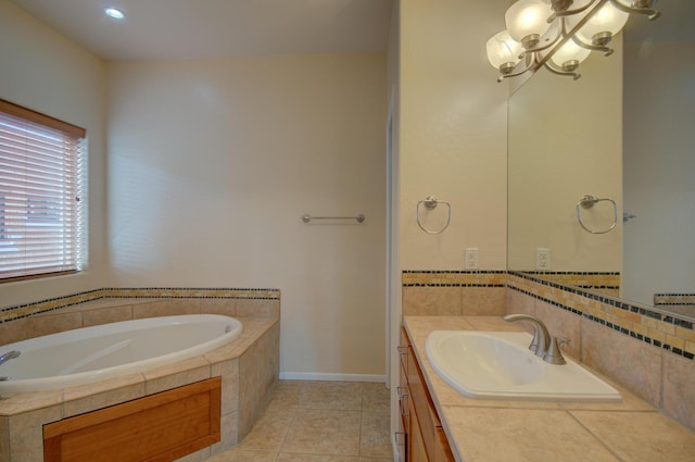 315 11th St SW, Albuquerque, NM 87102 - bathroom with vanity, a garden tub, tile patterned floors, and a chandelier
