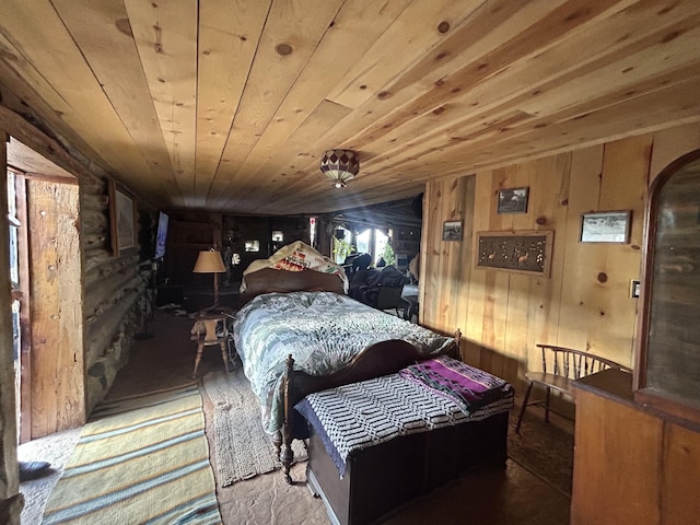 bedroom with wooden ceiling and wooden walls