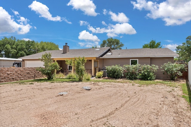 36 Palomas Rd, Los Lunas, NM 87031 - view of front of home featuring a chimney and a garage