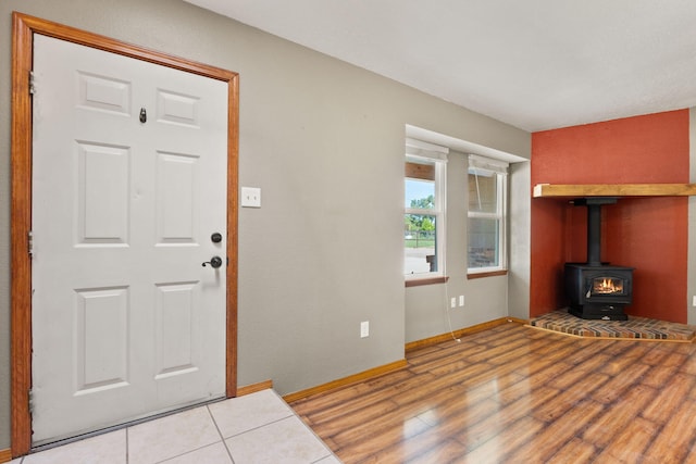 36 Palomas Rd, Los Lunas, NM 87031 - entrance foyer featuring wood finished floors and a wood stove
