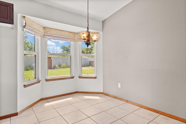 36 Palomas Rd, Los Lunas, NM 87031 - unfurnished dining area featuring a chandelier, healthy amount of natural light, and light tile patterned flooring