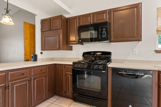 36 Palomas Rd, Los Lunas, NM 87031 - kitchen featuring black appliances, light countertops, light tile patterned floors, and pendant lighting