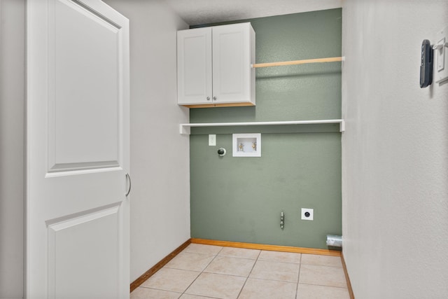 36 Palomas Rd, Los Lunas, NM 87031 - laundry area featuring hookup for an electric dryer, hookup for a washing machine, light tile patterned flooring, and cabinet space