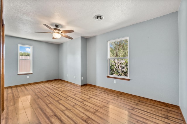 36 Palomas Rd, Los Lunas, NM 87031 - unfurnished room with a ceiling fan, wood finished floors, and a textured ceiling