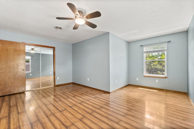 36 Palomas Rd, Los Lunas, NM 87031 - unfurnished bedroom featuring wood finished floors and ceiling fan