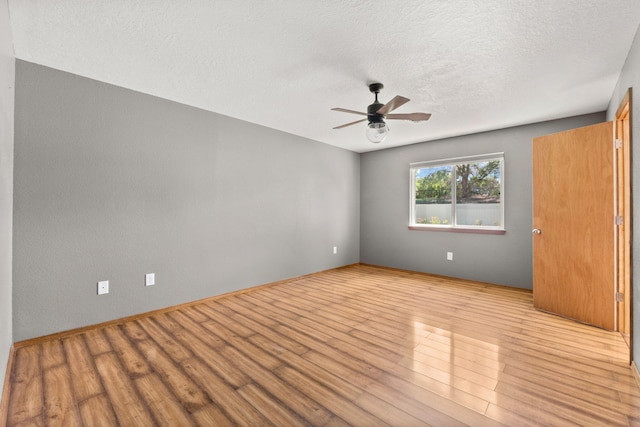 36 Palomas Rd, Los Lunas, NM 87031 - unfurnished room with a ceiling fan, wood finished floors, and a textured ceiling