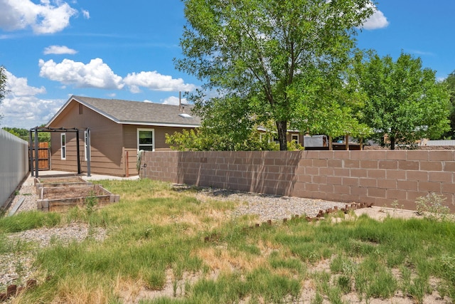 36 Palomas Rd, Los Lunas, NM 87031 - fenced backyard featuring a vegetable garden