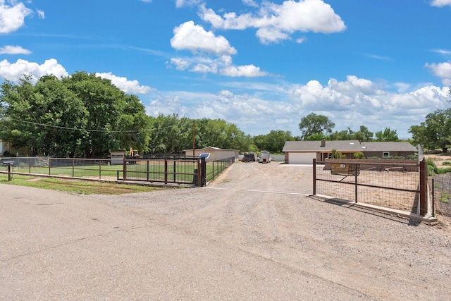 36 Palomas Rd, Los Lunas, NM 87031 - view of street featuring a gate and a gated entry