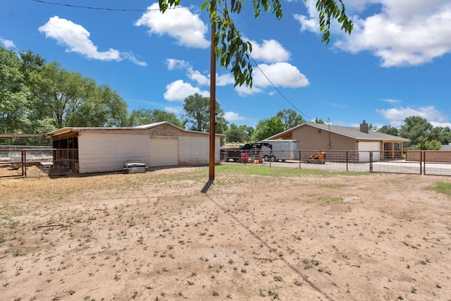 36 Palomas Rd, Los Lunas, NM 87031 - view of yard featuring an exterior structure, an outbuilding, and a detached garage