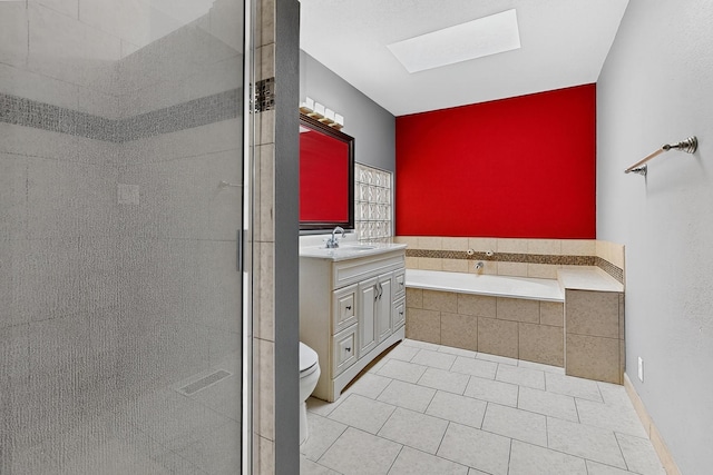 5415 Colleens Way NE, Albuquerque, NM 87111 - bathroom featuring a skylight, vanity, a bath, tiled shower, and tile patterned floors