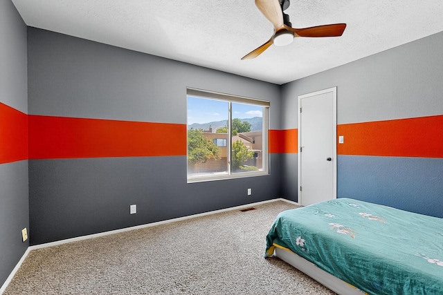 5415 Colleens Way NE, Albuquerque, NM 87111 - carpeted bedroom with ceiling fan and a textured ceiling