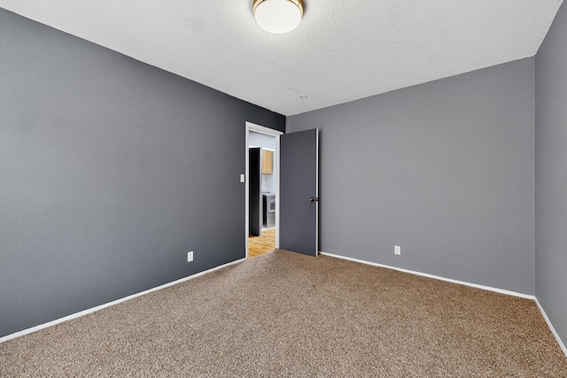5415 Colleens Way NE, Albuquerque, NM 87111 - carpeted empty room with baseboards and a textured ceiling