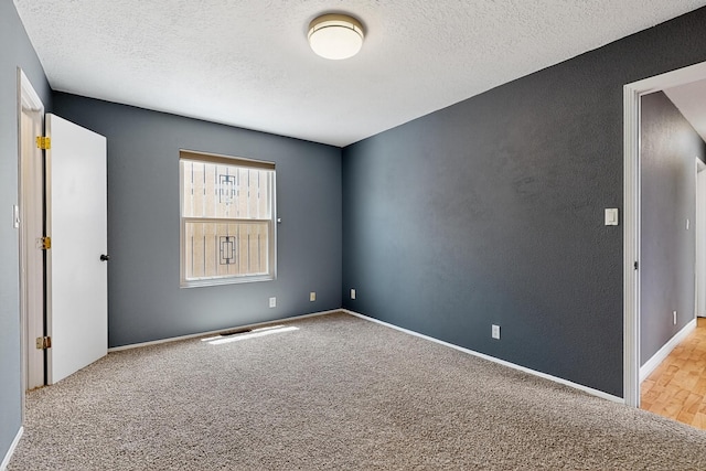 5415 Colleens Way NE, Albuquerque, NM 87111 - carpeted spare room featuring a textured ceiling and baseboards