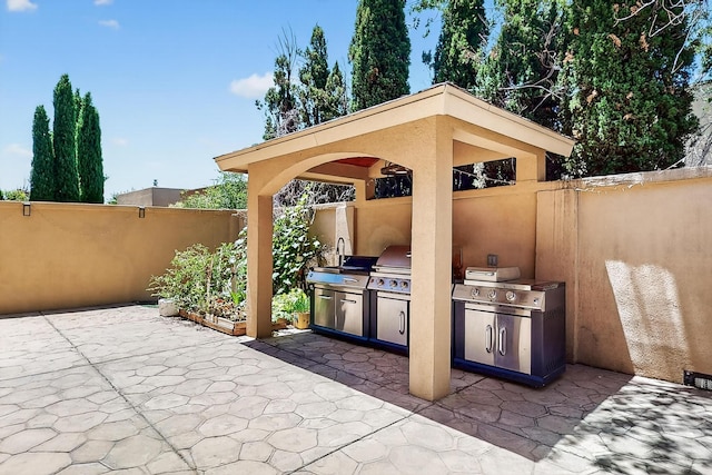 5415 Colleens Way NE, Albuquerque, NM 87111 - view of patio / terrace featuring an outdoor kitchen and a sink