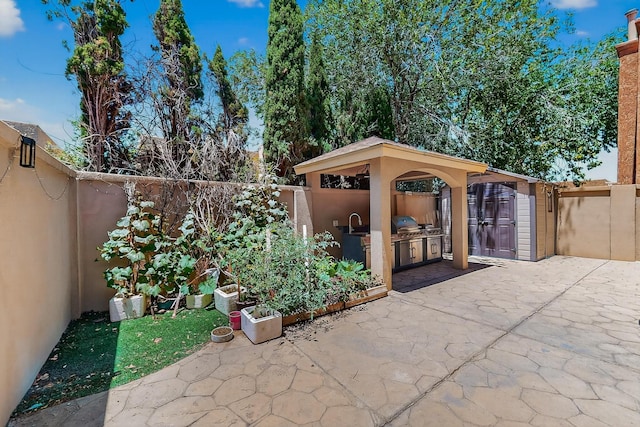 5415 Colleens Way NE, Albuquerque, NM 87111 - fenced backyard with area for grilling and a patio