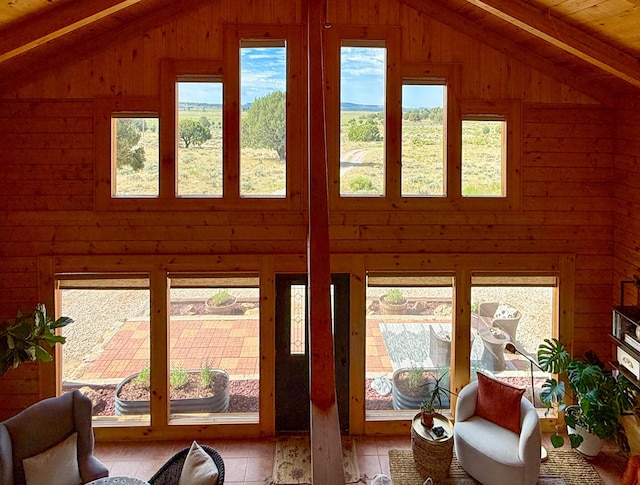 195 Ferguson Rd, Ramah, NM 87321 - living area with vaulted ceiling, healthy amount of natural light, and wood walls