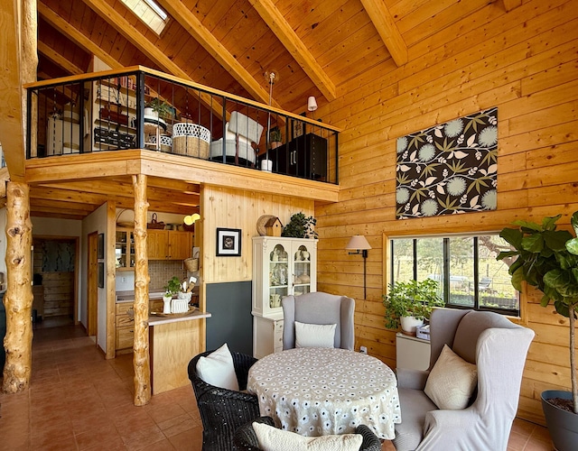 195 Ferguson Rd, Ramah, NM 87321 - dining space featuring tile patterned flooring, high vaulted ceiling, a wooden ceiling with exposed beams, and wooden walls