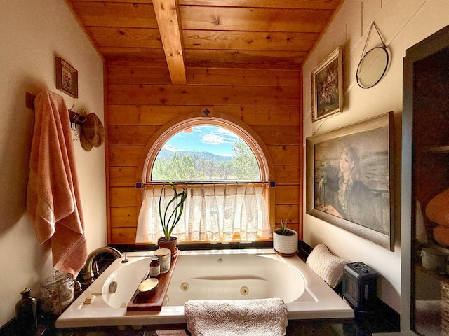 195 Ferguson Rd, Ramah, NM 87321 - bathroom with wooden ceiling, wooden walls, and a tub with jets