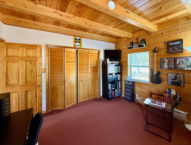 195 Ferguson Rd, Ramah, NM 87321 - office space with a wood ceiling with exposed beams, wood walls, and dark carpet