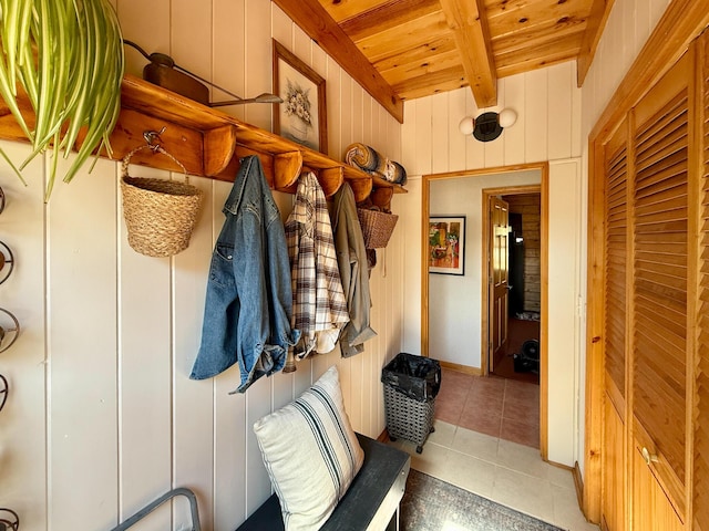 195 Ferguson Rd, Ramah, NM 87321 - mudroom with a wooden ceiling with exposed beams, tile patterned flooring, and wooden walls