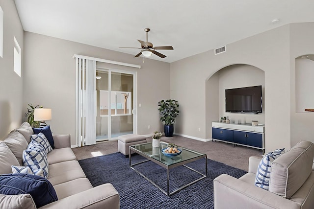 2048 N Ensenada Cir SE, Rio Rancho, NM 87124 - living room featuring ceiling fan, dark carpet, and arched walkways