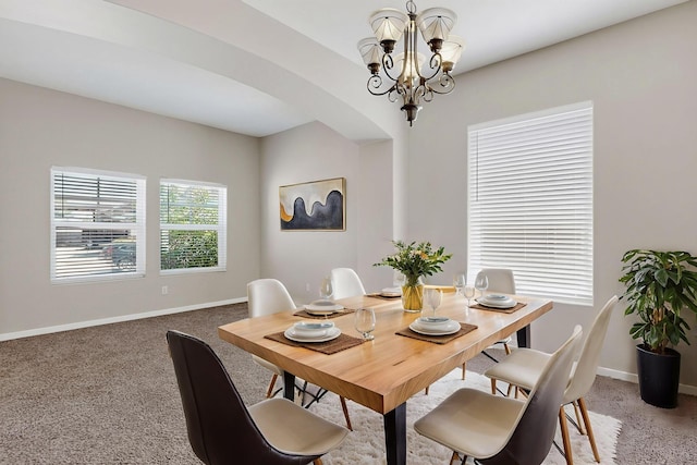 2048 N Ensenada Cir SE, Rio Rancho, NM 87124 - dining area with a chandelier, light carpet, and arched walkways