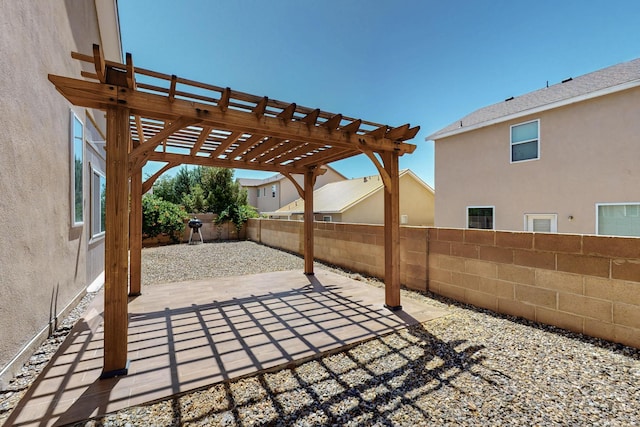 2048 N Ensenada Cir SE, Rio Rancho, NM 87124 - fenced backyard with a patio and a pergola