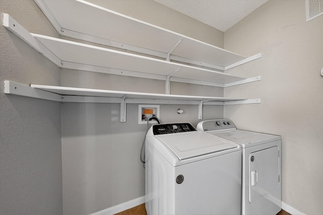 2048 N Ensenada Cir SE, Rio Rancho, NM 87124 - washroom featuring washing machine and dryer and baseboards