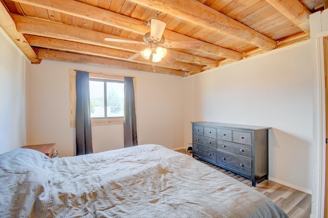 58 Quiet Valley Loop, Edgewood, NM 87015 - bedroom featuring a wooden ceiling with exposed beams, wood finished floors, and ceiling fan