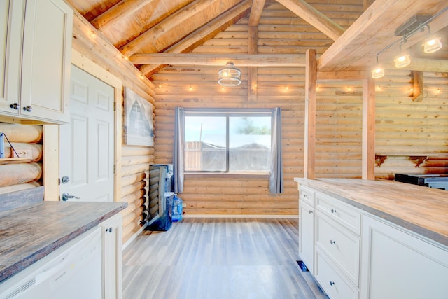58 Quiet Valley Loop, Edgewood, NM 87015 - kitchen with log walls, dishwasher, light wood-style flooring, white cabinetry, and wood ceiling