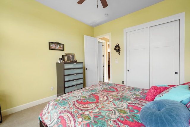 2308 Desert View Rd NE, Rio Rancho, NM 87144 - bedroom with light colored carpet, a closet, and a ceiling fan