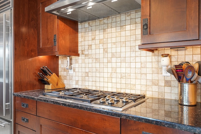 2308 Desert View Rd NE, Rio Rancho, NM 87144 - kitchen featuring wall chimney exhaust hood, stainless steel appliances, backsplash, and brown cabinetry
