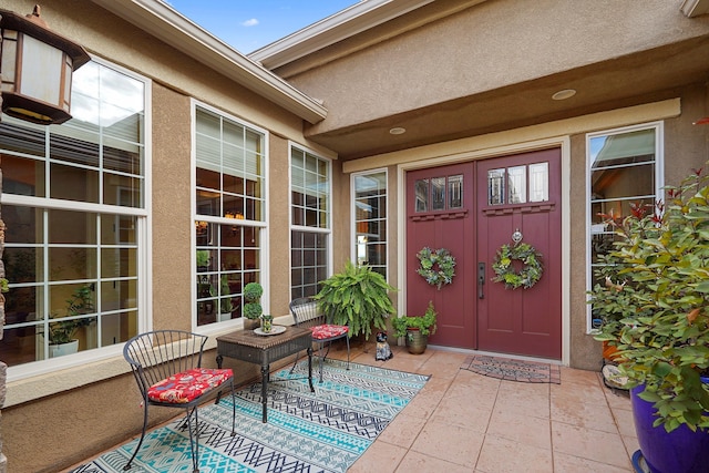 2308 Desert View Rd NE, Rio Rancho, NM 87144 - property entrance with stucco siding and a patio