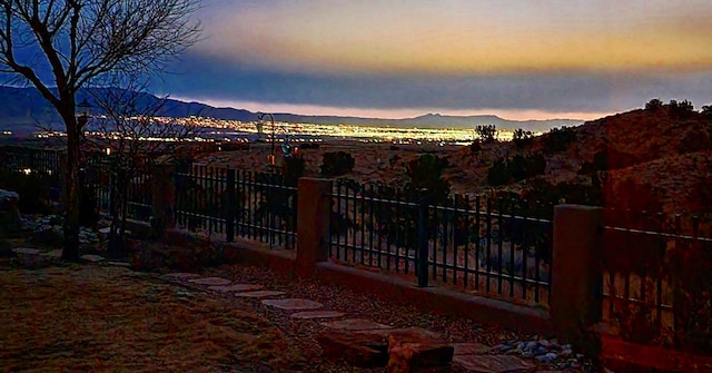 2308 Desert View Rd NE, Rio Rancho, NM 87144 - yard at dusk with a mountain view