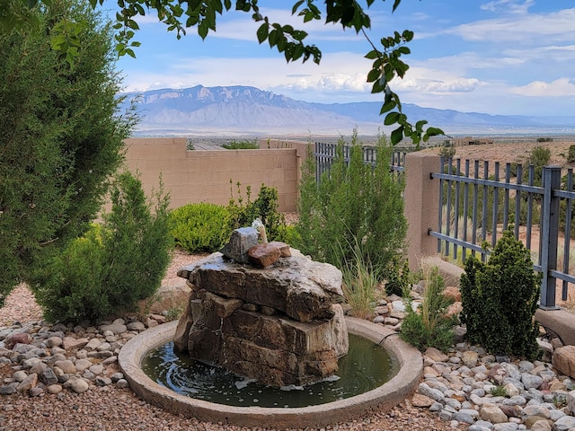 2308 Desert View Rd NE, Rio Rancho, NM 87144 - view of yard featuring a mountain view and a garden pond
