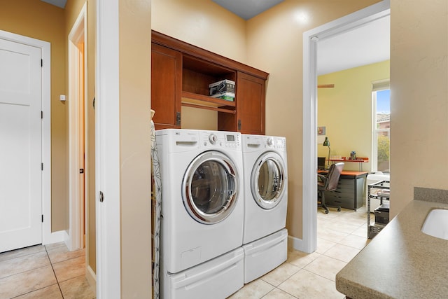 2308 Desert View Rd NE, Rio Rancho, NM 87144 - washroom featuring washing machine and clothes dryer, cabinet space, light tile patterned flooring, and an office area