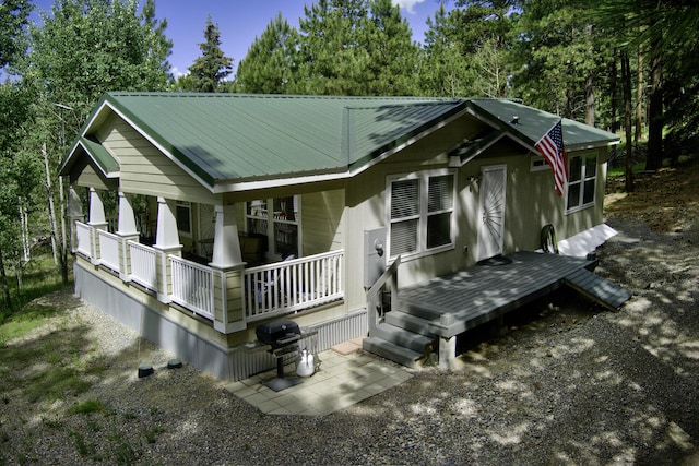 150 Ponderosa Way, Jemez Springs, NM 87025 - view of front of house with a metal roof and covered porch