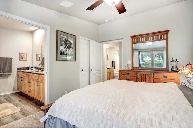 150 Ponderosa Way, Jemez Springs, NM 87025 - bedroom featuring wood finished floors and ensuite bathroom