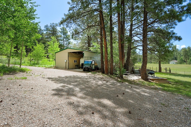150 Ponderosa Way, Jemez Springs, NM 87025 - exterior space featuring an outdoor structure and view of wooded area
