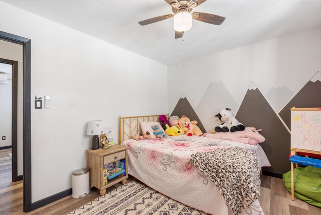 1257 Dinkle Rd, Stanley, NM 87056 - bedroom with wood finished floors and ceiling fan