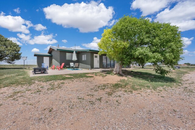 1257 Dinkle Rd, Stanley, NM 87056 - back of house featuring a patio area and stucco siding