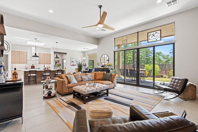 3204 Maxum Ln NW, Albuquerque, NM 87104 - living area featuring light tile patterned floors, a ceiling fan, and recessed lighting