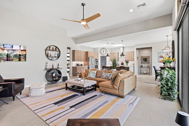 3204 Maxum Ln NW, Albuquerque, NM 87104 - living room with a ceiling fan, light tile patterned flooring, recessed lighting, and a chandelier