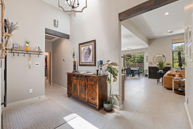 3204 Maxum Ln NW, Albuquerque, NM 87104 - corridor with a chandelier, light tile patterned flooring, recessed lighting, and a high ceiling