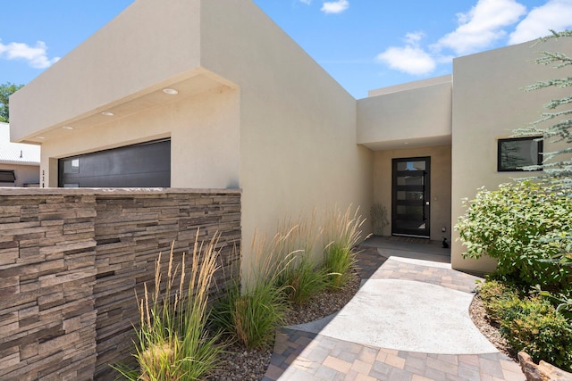 3204 Maxum Ln NW, Albuquerque, NM 87104 - doorway to property featuring stucco siding