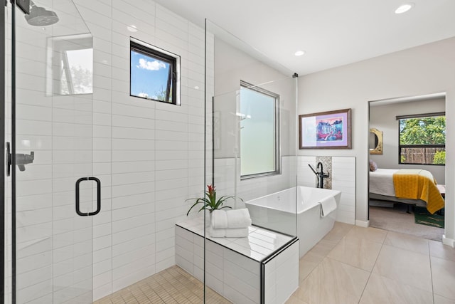 3204 Maxum Ln NW, Albuquerque, NM 87104 - full bathroom with a freestanding bath, a shower stall, connected bathroom, tile walls, and tile patterned floors