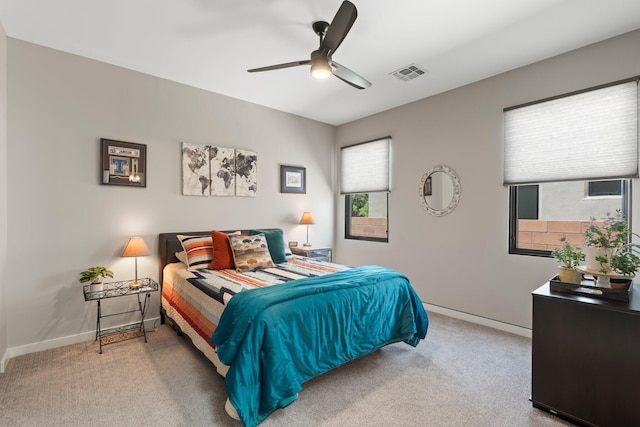 3204 Maxum Ln NW, Albuquerque, NM 87104 - carpeted bedroom with baseboards and a ceiling fan