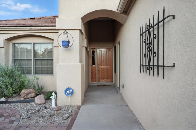 736 Gray Hawk Dr NE, Rio Rancho, NM 87144 - view of exterior entry featuring stucco siding