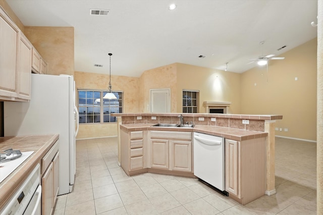 736 Gray Hawk Dr NE, Rio Rancho, NM 87144 - kitchen featuring white appliances, lofted ceiling, tile counters, light tile patterned flooring, and light brown cabinets